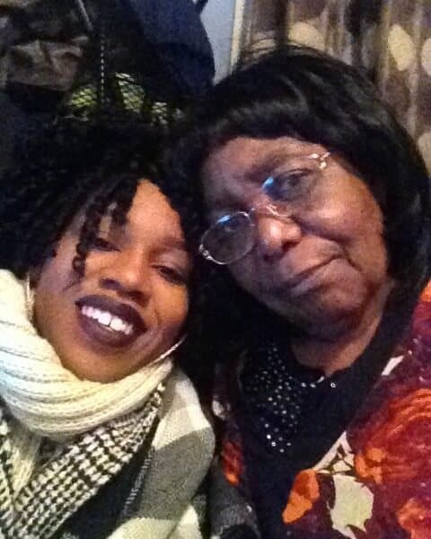 Grandmother and granddaughter smiling enjoying each others company
